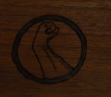 woodburned Jade Hand logo